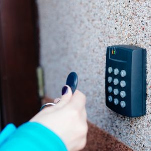 Woman operating a home access control system