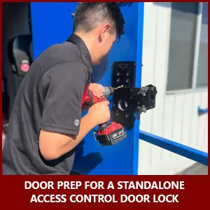 Locksmith is preparing a door for a standalone keypad access control lock