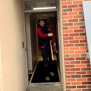 Locksmith in Ashville, NC prepares for a commercial door installation