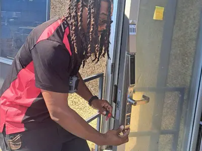 Technician installs a commercial door in Memphis