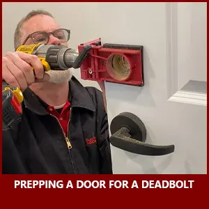 Tech preps a door for a deadbolt installation