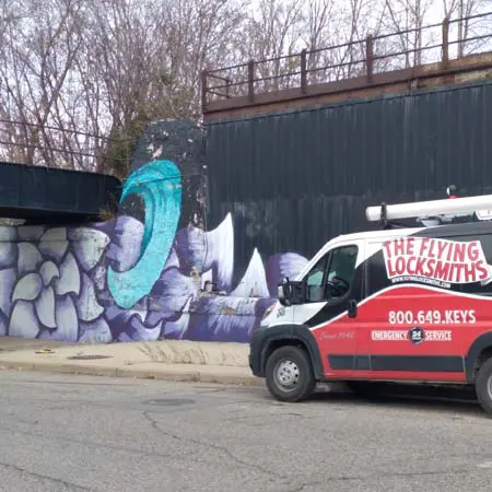 The Flying Locksmiths service van works on access control installation near Auburn Hills, MI