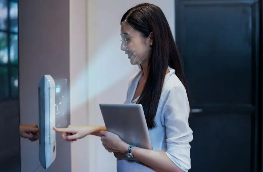 Employee uses facial recognition access control system to enter the office.