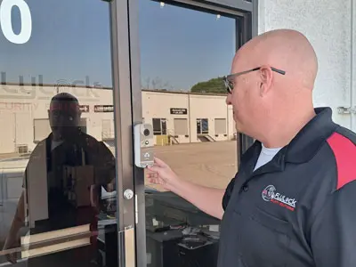 Technician installs a biometric face scan intercom system in Memphis, TN