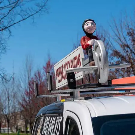 TFL service van driving to commercial business for automatic door operator installation near Charles City, VA