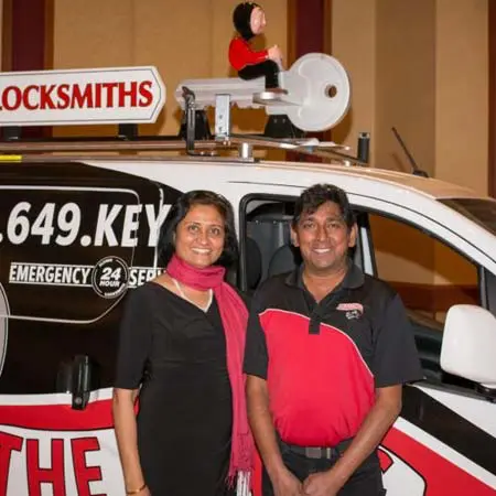The Flying Locksmiths of South Atlanta owners Latha and Ravi prepare for a security camera installation near Senoia, GA