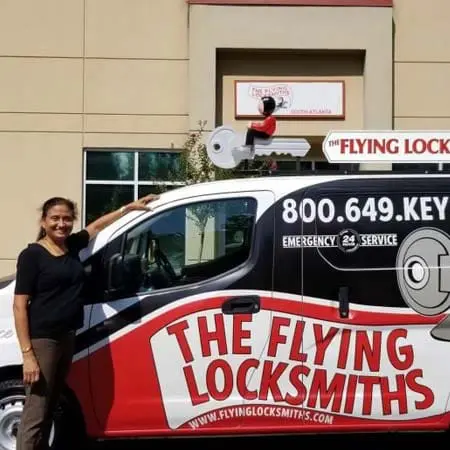 Photo of TFL owner Latha in front of a service van at the office in Peachtree City, GA