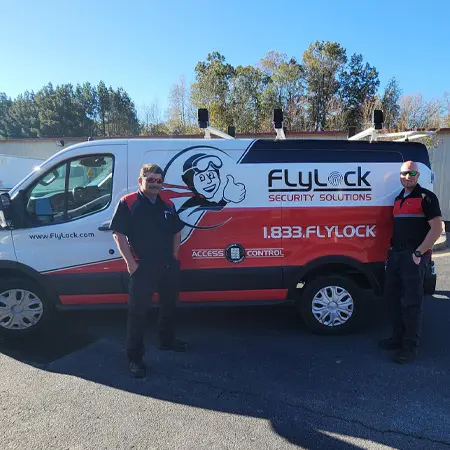 Technicians stand next to FlyLock Security Solutions Van in Peachtree City, GA