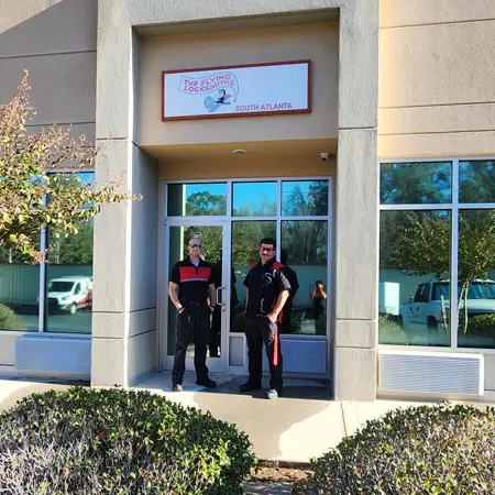 FlyLock Security Solutions technicians Will and Reuben stand outside office in Peachtree City, GA