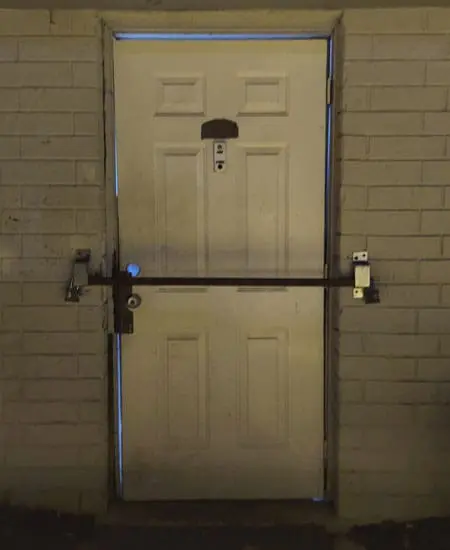 Image four of rust and light showing through an ugly door