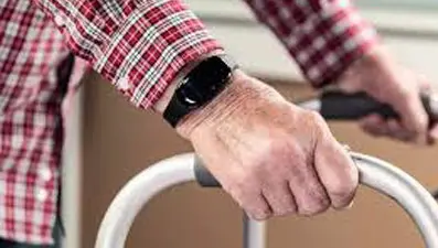 Man uses a WanderGuard bracelet in a healthcare facility