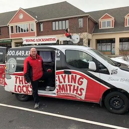 TFL locksmith helps local business by rekeying locks in his service van near Shrewsbury, MA