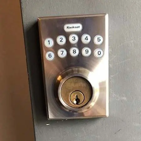 TFL locksmith technician helps commercial customer with a Qwikset keypad lock install near Marlborough, MA