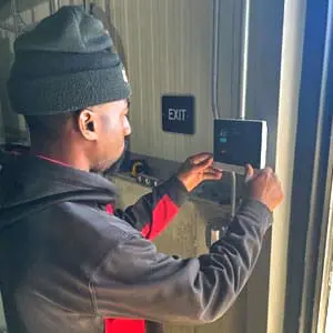 Security Technician Installs Door Controller for an Access Control System in Grand Haven, MI
