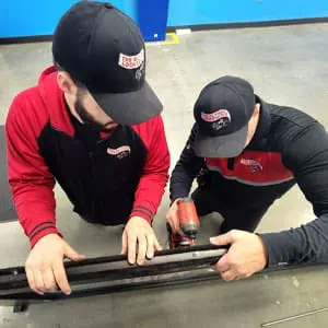 Locksmiths Working on a Door Repair Service in Grand Rapid, MI