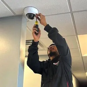 West Michigan Security Technician Installs a Dome Camera in Spring Lake