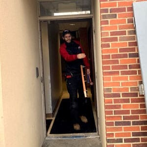 Locksmith in Ashville, NC prepares for a commercial door installation