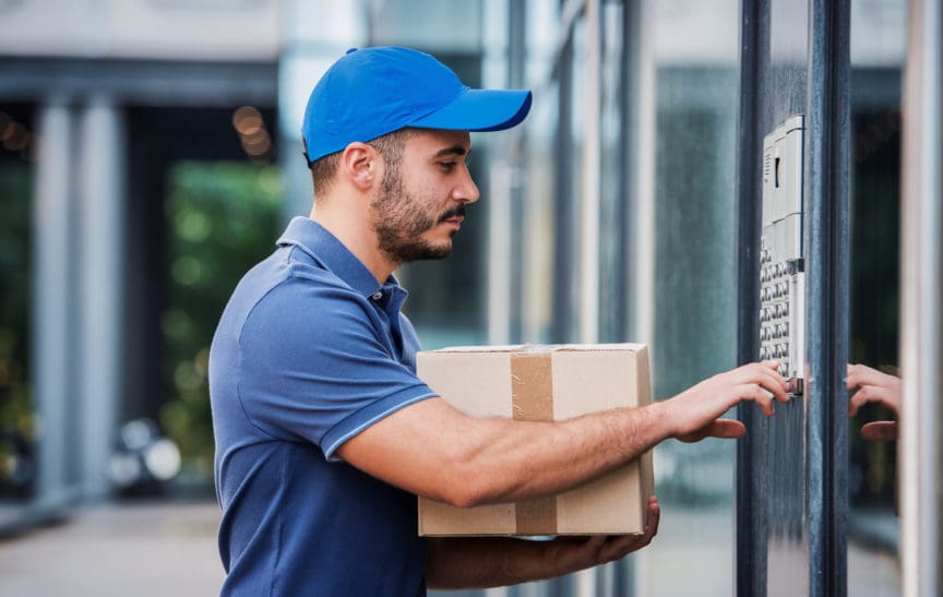 Delivery Person Using Building Intercom System