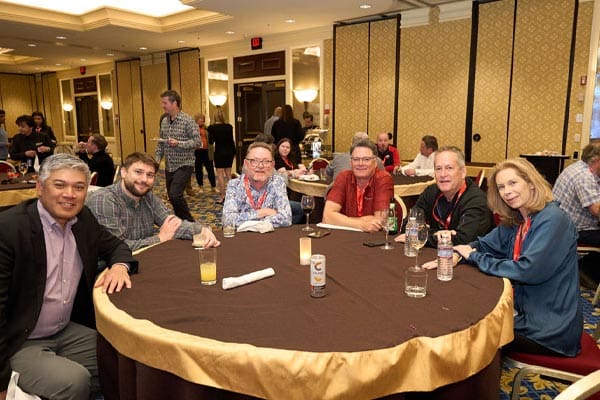 Security franchise owners sit around the table during an awards dinner