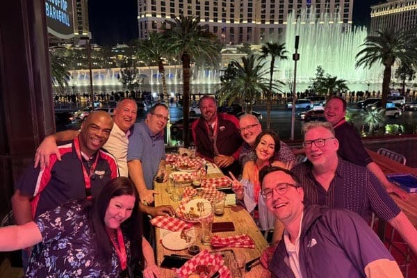 FlyLock security franchise owners enjoying a group photo at a roof top