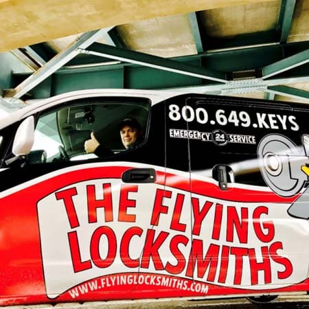 The Flying Locksmiths service technician driving to an access control installation near St. Paul, MN