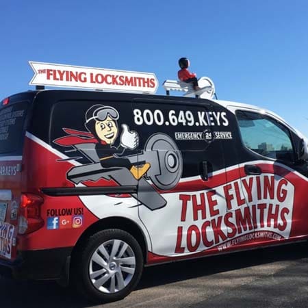 The Flying Locksmiths service van at a project doing commercial door repair near Minnetonka, MN