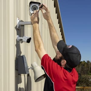 Security Technician Performs Maintenance on CCTV Camera in Spartanburg, SC
