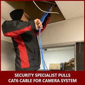 Security Specialist Pulls Cable For CCTV Cameras