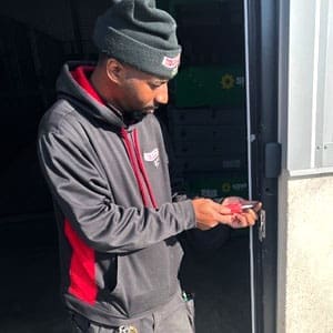Locksmith Doing a Commercial Door Hardware Installation in Holland, Michigan