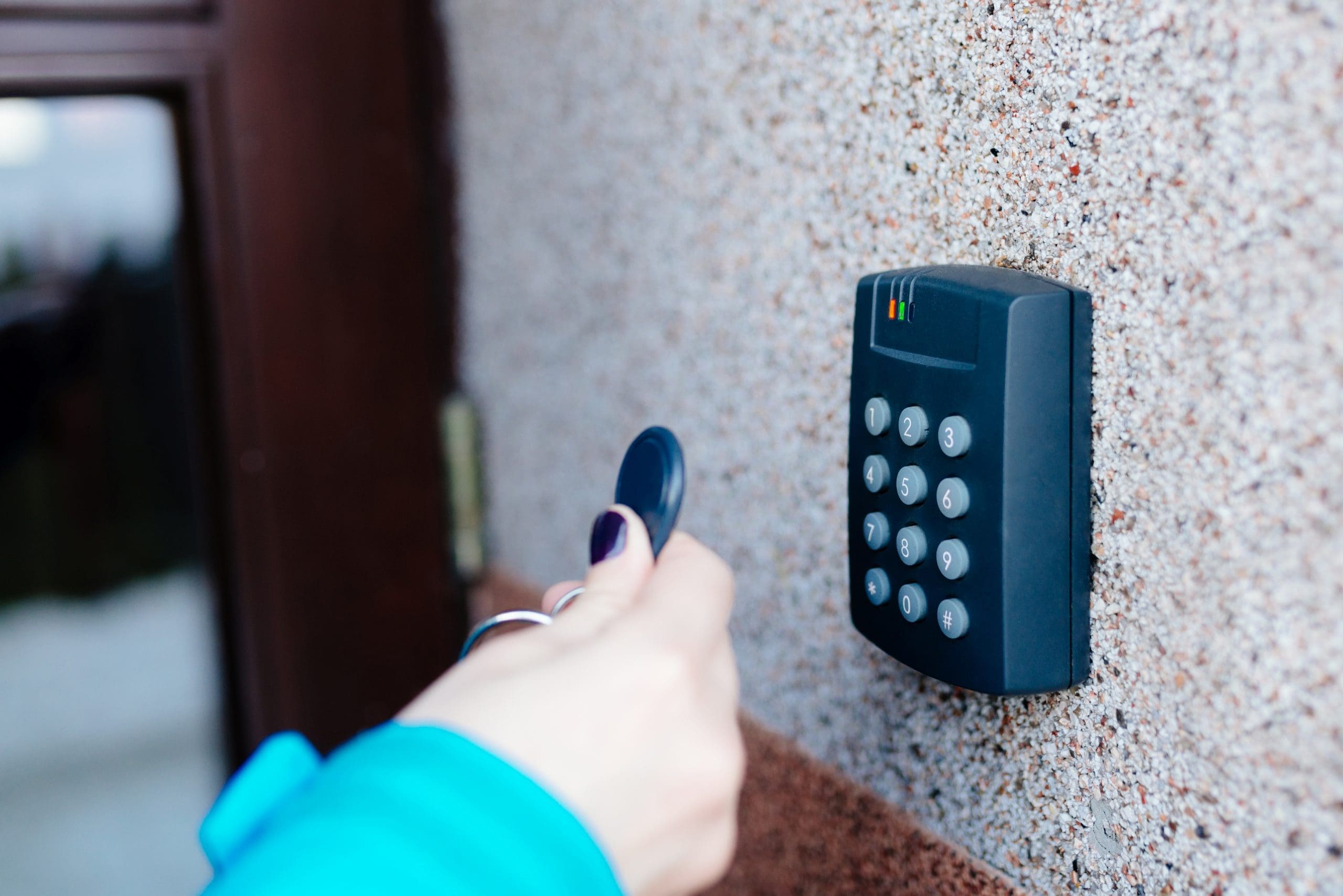 Woman operating a home access control system